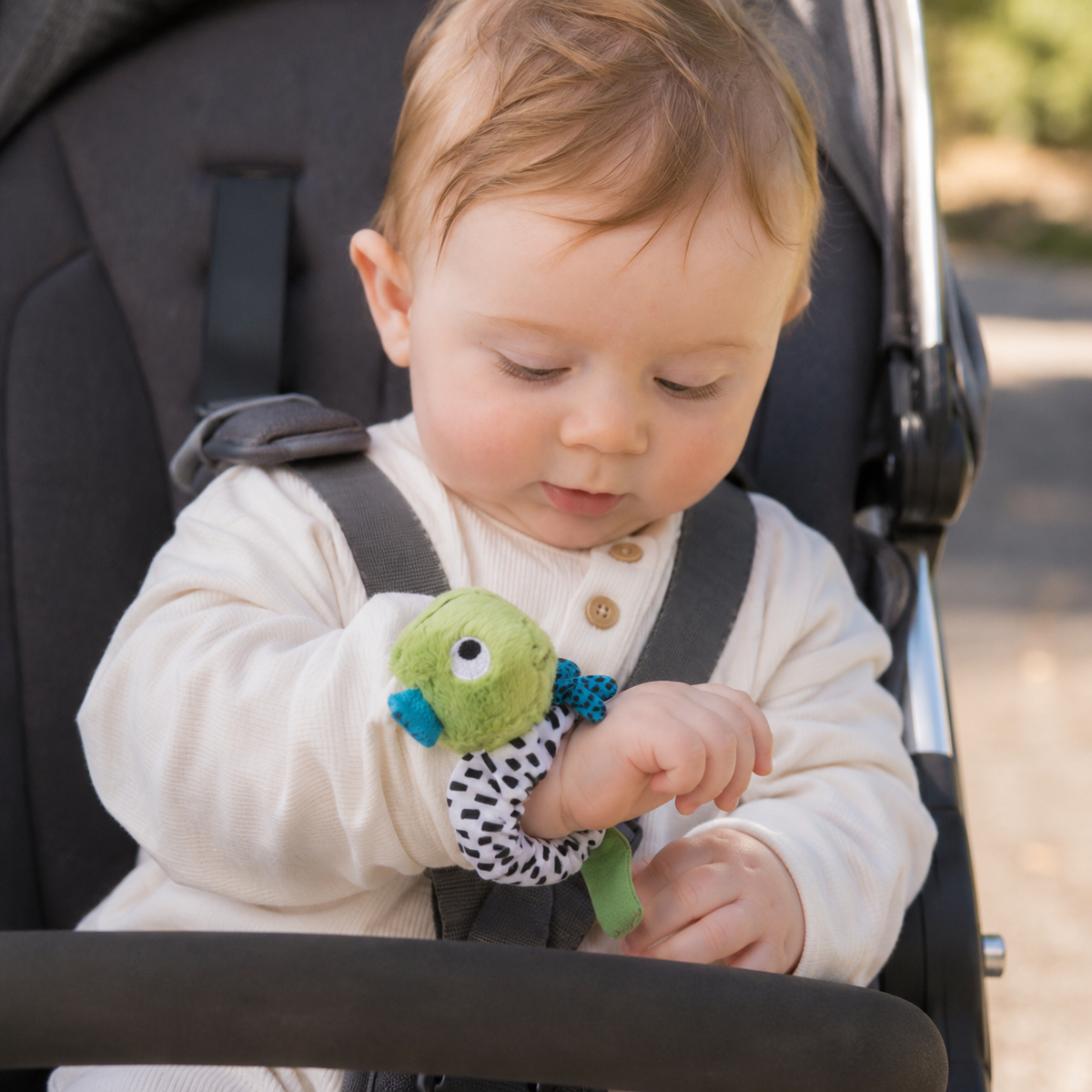 Ziggle Baby plišasta zapestna ropotuljica - dino